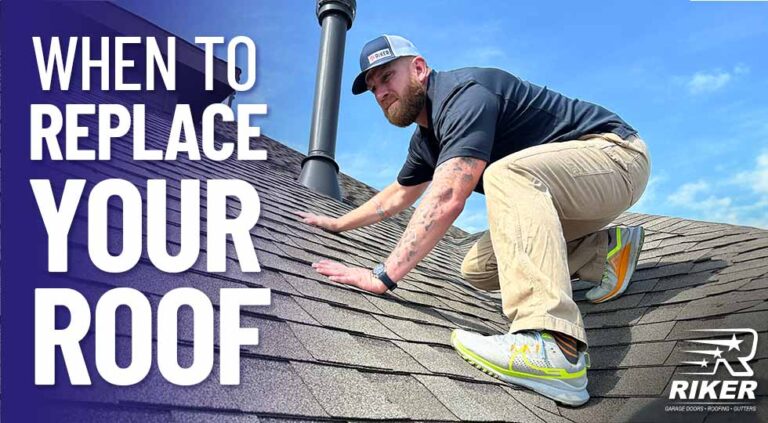 Adam Farmer from Riker Home Services inspecting the shingles of a roof, crouching with one hand on the roof for support. He is wearing a Riker-branded baseball cap, a dark shirt, beige cargo pants, and athletic shoes. The background displays a bright, blue sky. To the left of the man, in large, bold white text, it reads, "When to Replace Your Roof."